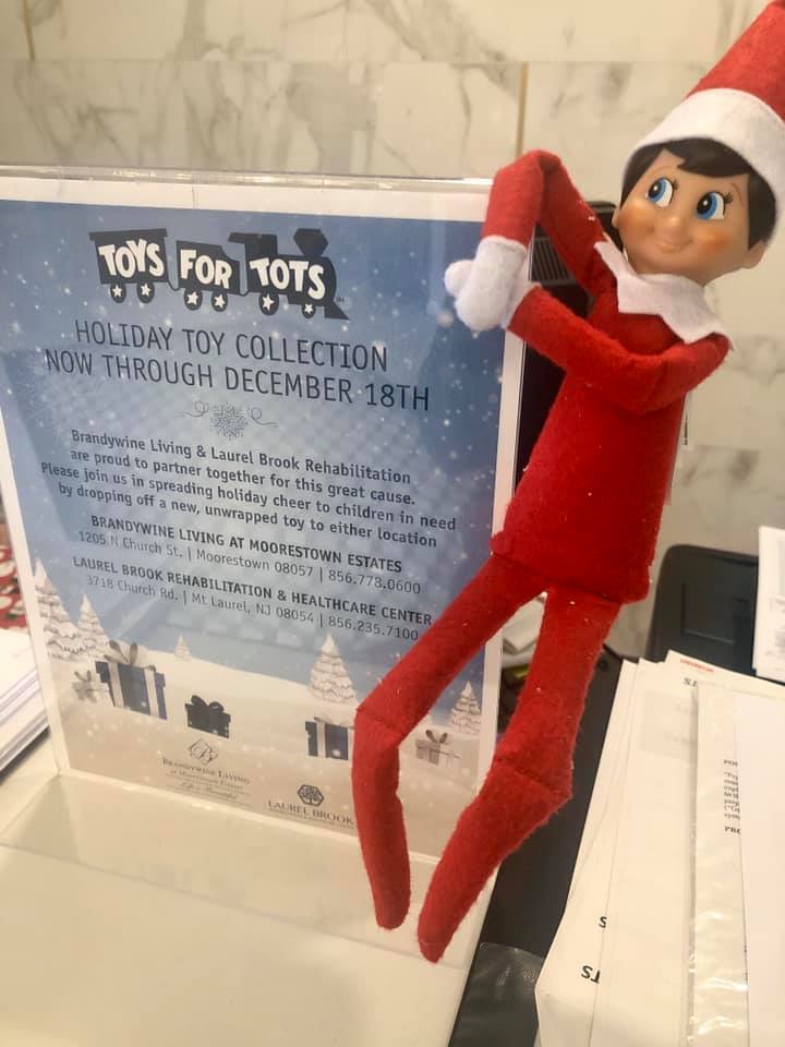 Toys For Tots With Cosmo The Elf